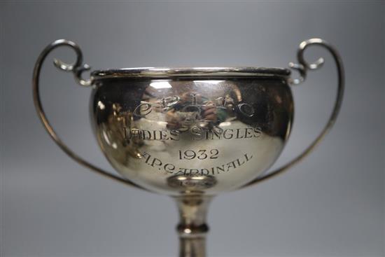 Five assorted small silver trophy cups, all with engraved inscriptions, tallest 12cm, and a silver mounted glass scent bottle.